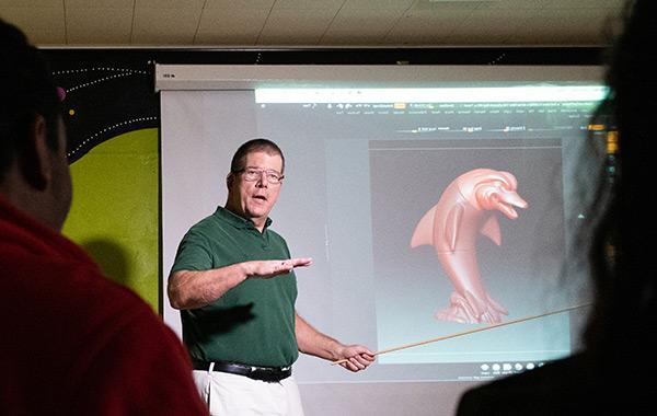 Professor Eric Kunzendorf points out features of ZBrush to a class of animation students.