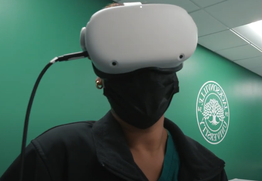 Student experiences a VR simulation.